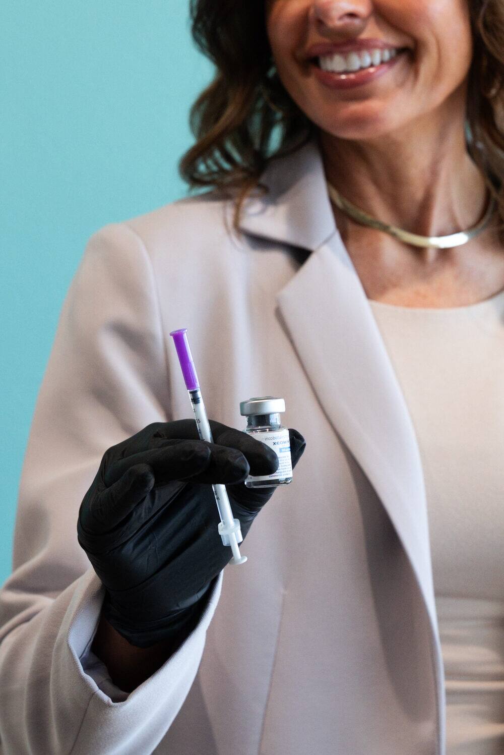 REVIVE clinician with treatment pen, ready for client consultation