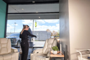 Medical Assistant Michaela preparing and IV drip for a patient in the Hydration IV Lounge at Revive Infusions and Wellness at Champion One Plaza on Garden Valley Blvd in Roseburg, Oregon.