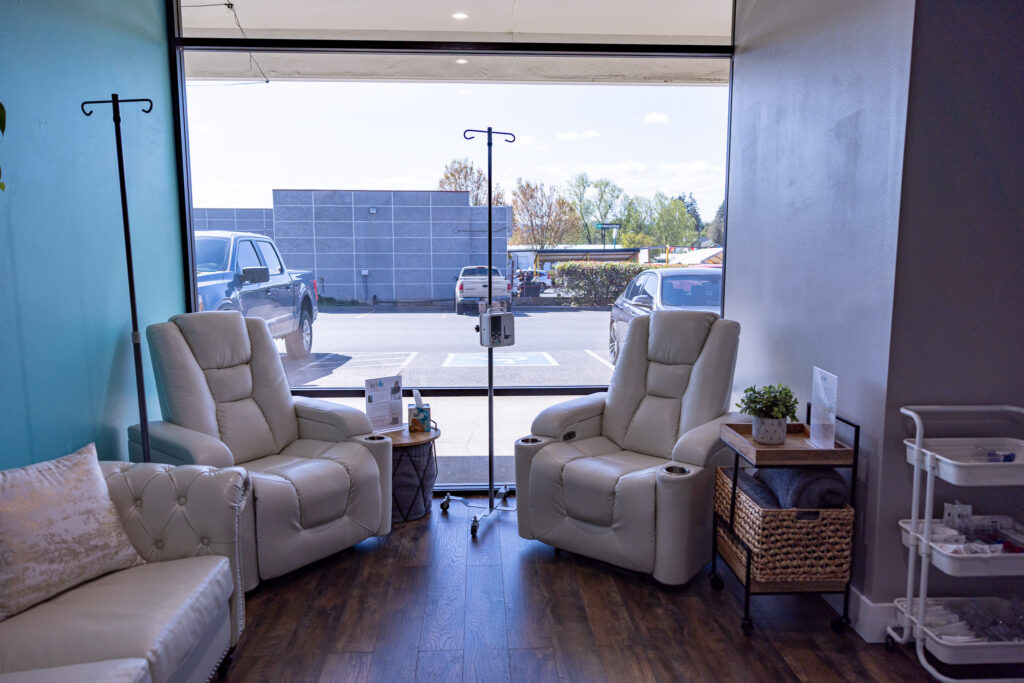 Revive Infusions & Wellness Hydration Lounge and Group IV treatment space Hydration Lounge and Group IV treatment area at Revive Infusions & Wellness, a luxury medical spa in Roseburg, Oregon, offering IV nutrient therapy for wellness, hydration, and immune support.