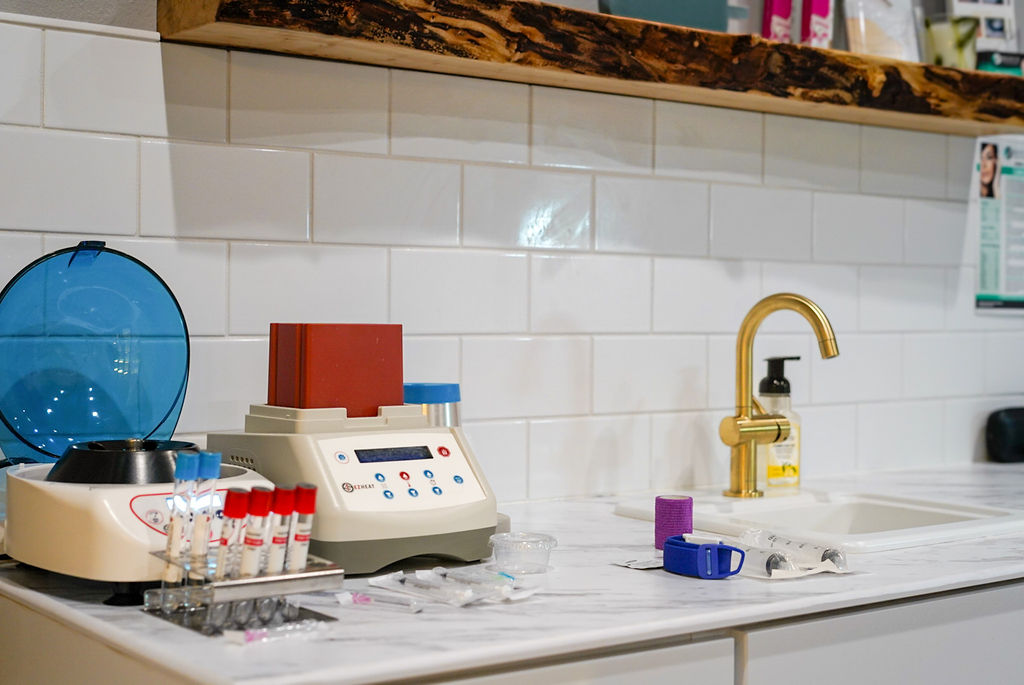 Medical office counter with centrifuge and set up for platlet ritch plasma injections. PRP and PRF regenerative treatments at Revive Infusions & Wellness in Roseburg, Oregon support natural healing, collagen production, and tissue repair using the patient’s own blood-derived growth factors. This image highlights advanced platelet-rich plasma and platelet-rich fibrin therapy performed in a luxury medical spa setting serving Douglas County. PRP and PRF treatments are commonly used for facial rejuvenation, hair restoration, skin health, and anti-aging solutions. Patients in Roseburg seeking non-surgical regenerative medicine benefit from customized protocols delivered by trained medical professionals in a private, upscale environment.