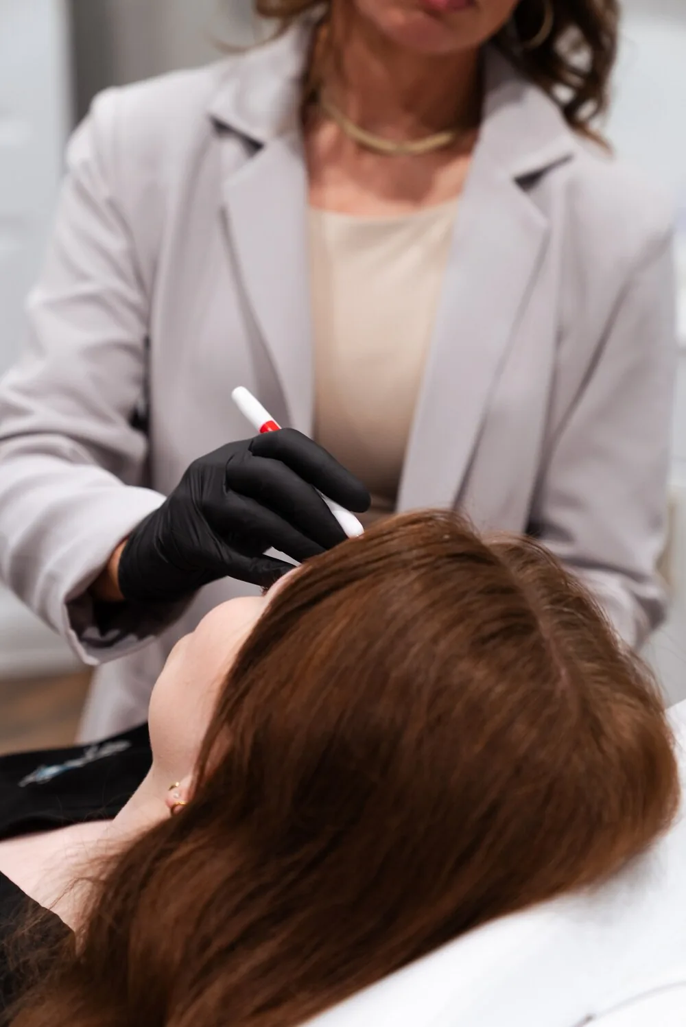Hair restoration treatment application at REVIVE Roseburg