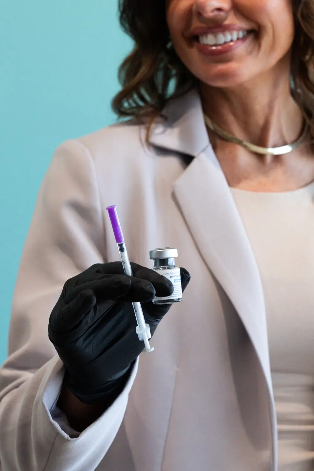 REVIVE clinician with treatment pen, ready for client consultation