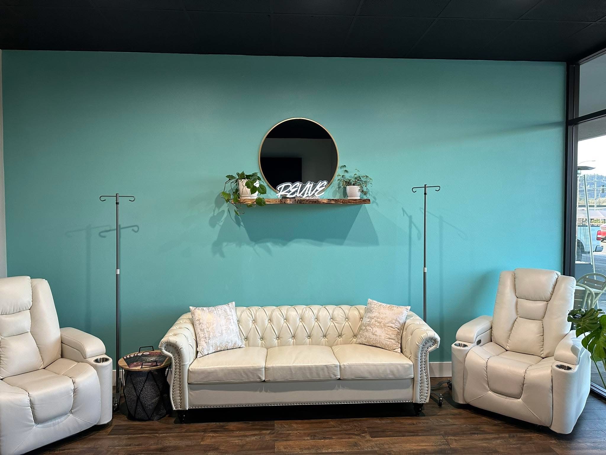 Calm IV nutrient therapy lounge with comfortable recliners and natural light